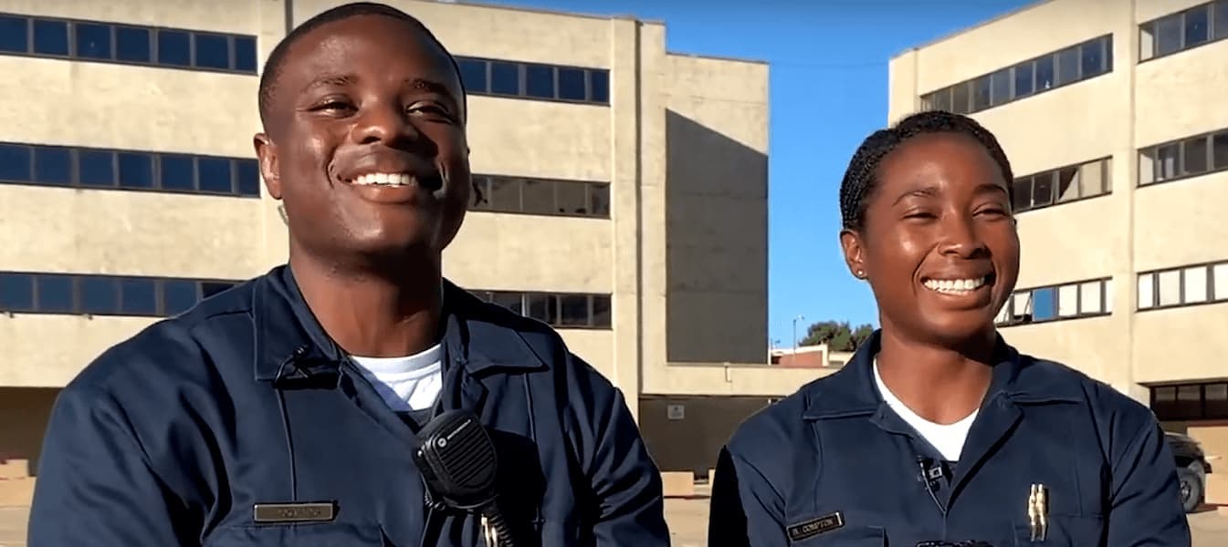 Two officers smiling together